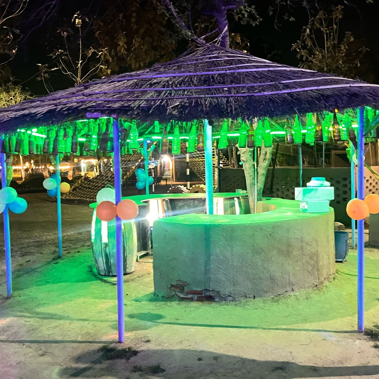 The bar and seating area lit up at night
