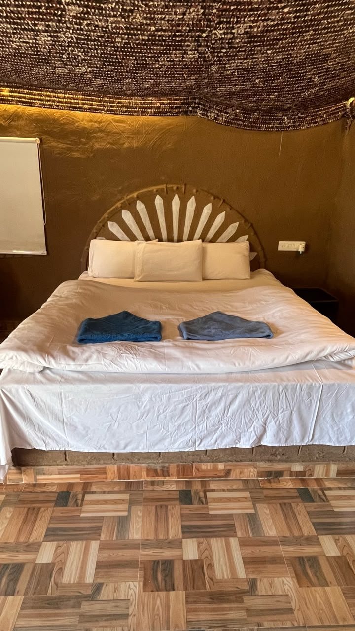 Swiss cottage bed with fresh linen and towels